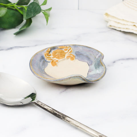 Spoon rest with crab design.