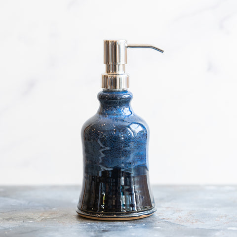 Ceramic soap dispenser with dark blue glaze