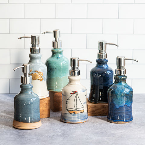 Ceramic soap dispensers in various pottery glazes