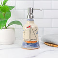 Ceramic soap dispenser with sailboat design 